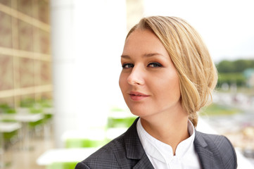 Closeup portrait of cute young business woman smiling