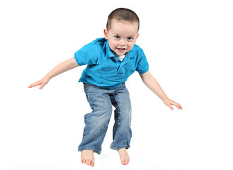 Cute little boy posing for camera on white background