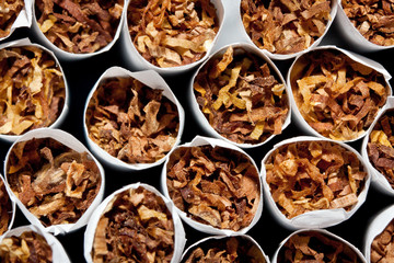 Close up of a smoking cigarettes in a stack