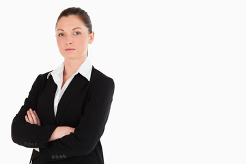 Attractive woman in suit posing while standing