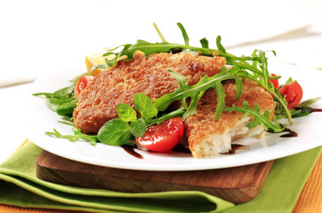 Fried fish and fresh salad