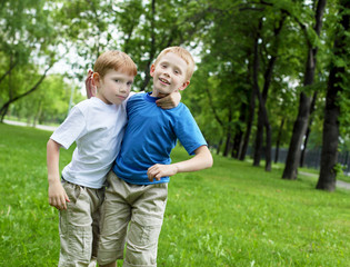 Fototapeta premium Portrait of two boys in the summer outdoors