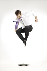 angry businessman jumping and stomping on portfolio
