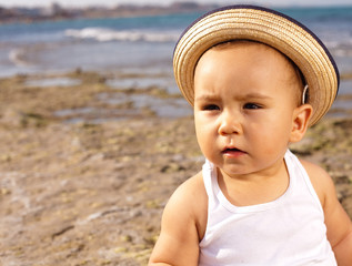 baby with straw hat