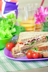 Sandwiches with bacon, chicken, lettuce and tomato