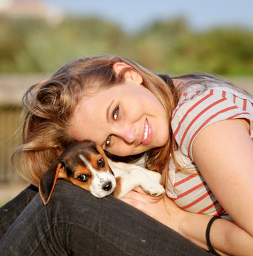 Happy Teen Young Woman With Her Pet Puppy Dog