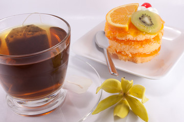 Tea and cake on white background