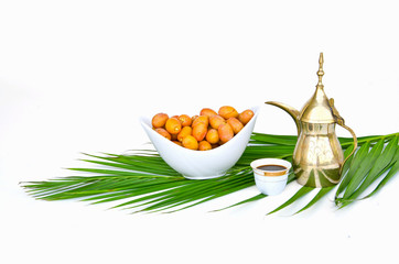 Arabic coffee pot with date fruits