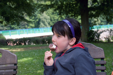 Freckled girl eating ice cream