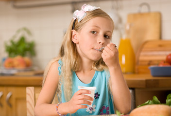 girl eating yoghurt