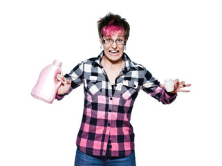 Frustrated young woman holding detergent