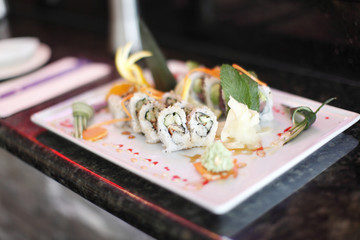 Plate of sushi with garnish