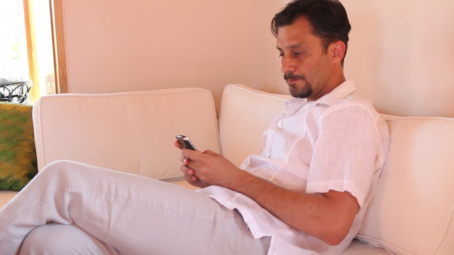 sad man using a phone,  shoot Canon 5D MarkII
