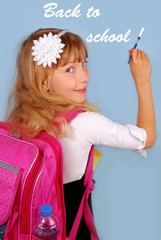 schoolgirl writing on blue background by brush