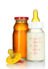 juice, baby bottle and pacifier isolated on white