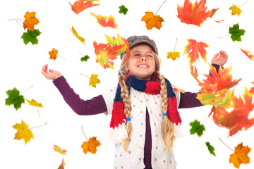 girl throwing up autumn leaves