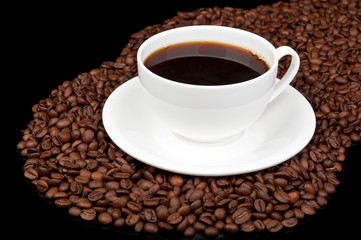 white cup with coffee and coffee beans