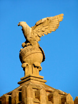 sculpture of  eagle on  sphere with zodiac signs in barcelona,