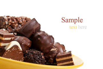 chocolate candy on yellow plate