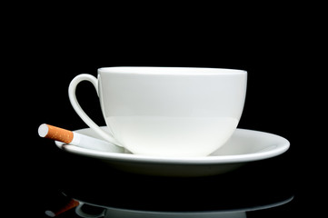 Creative breakfast with cup and cigarettes