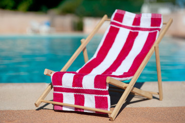 Beach chair near swimming pool