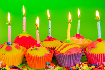 Colorful cupcakes with candles