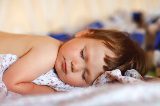 bright portrait of adorable sleeping baby
