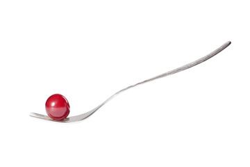 Fototapeta premium cherry on fork isolated on white background