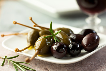 Marinated olives and caper berries