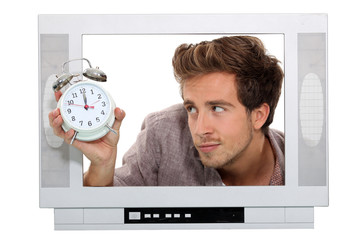 Man in television with alarm clock