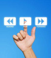 Hand pressing play button