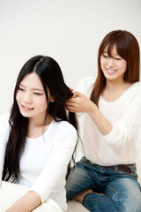 beautiful asian women taking care of her hair