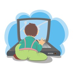 a boy playing laptop