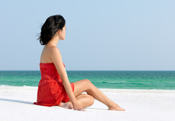 Fototapeta na wymiar Woman Relaxing on Beach