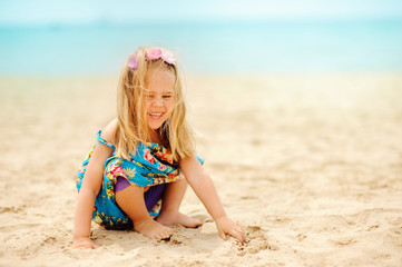 pretty little girl have a fun on sandy beach baskground