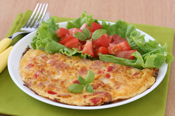 Omelet with ham and salad