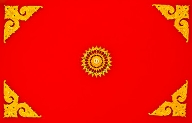 a lamp and decoration on temple 's ceiling