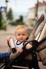 Toddler in baby carriage