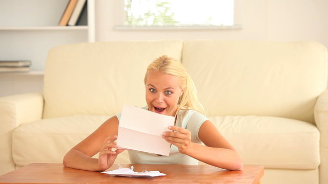 Cheerful woman receiving a mail