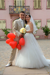 Bride and groom with balloons