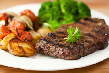 Grilled steak and vegetables on a plate
