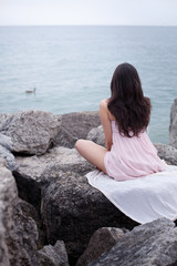 Nice sexy romantic young woman near waterfront