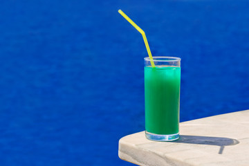 Cocktail on marble table at beach