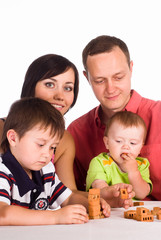 family plays at table