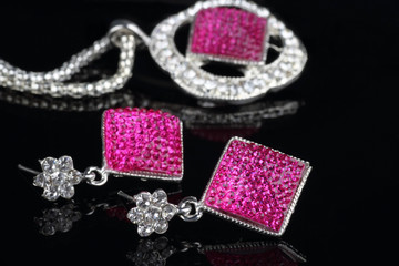 Pink Colored Jewelry Set with Earrings in focus