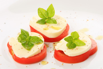 Served tomato with mozzarella and basil