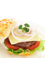 Tasty hamburger with beef patty and tomato