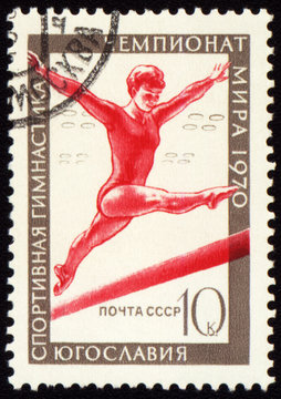 Post stamp shows female gymnast on balance beam