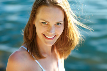 Young woman at the beach on a sunny day