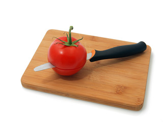 Red tomato on the white background